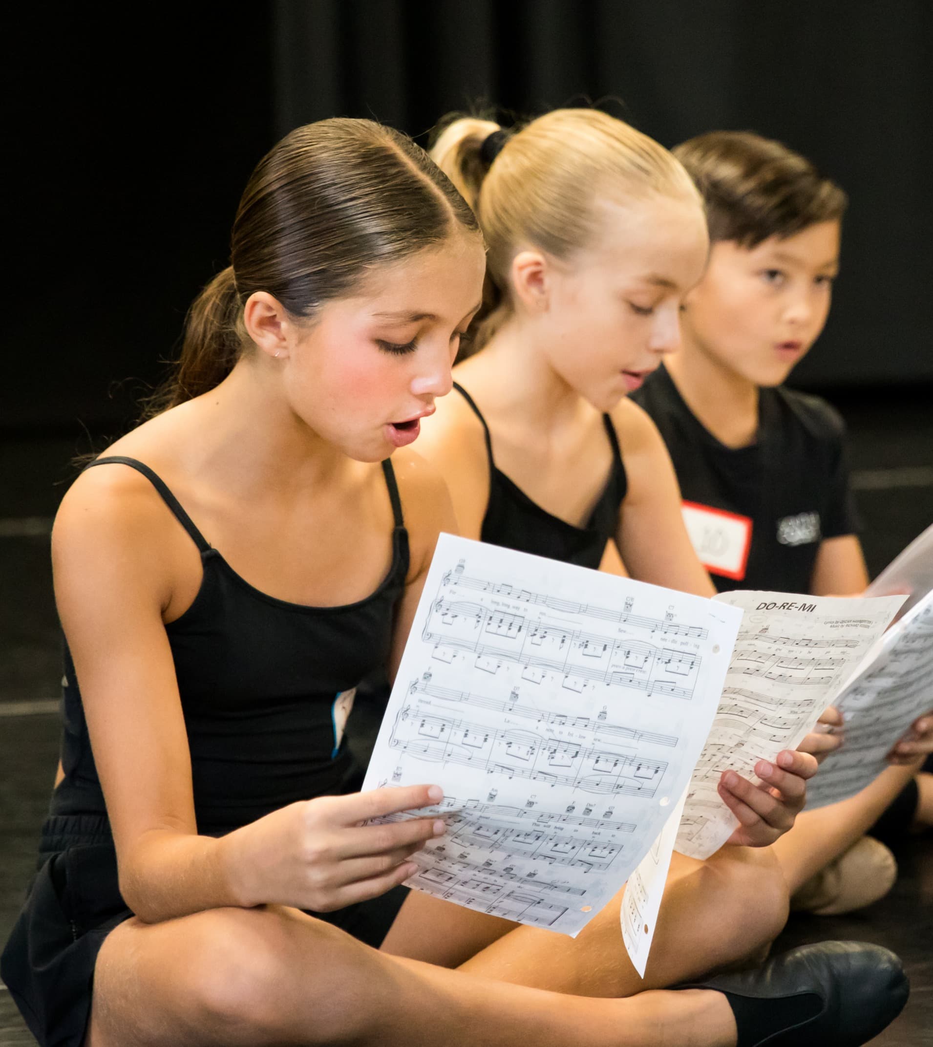 Young musical theatre students learning basics