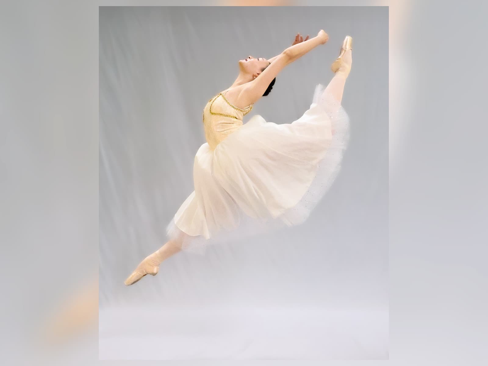 Ballet dancer performing a leap during intensive training
